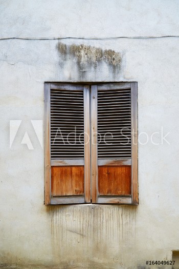 Picture of The old window covered with wooden shutters in the old town in Riga